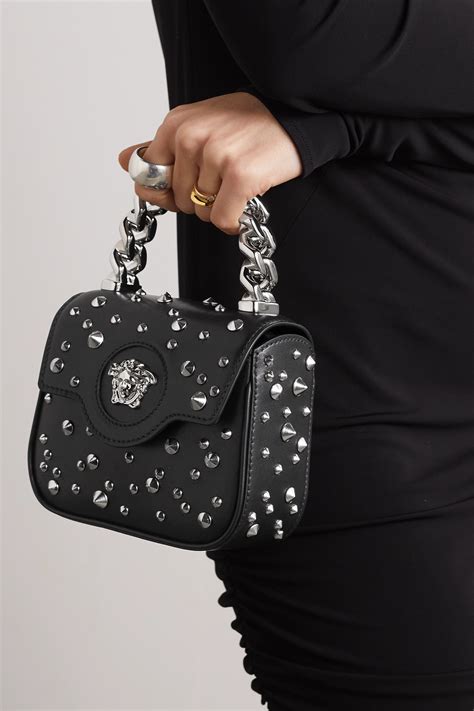 versace black studded shoulder bag|Versace embellished leather shoulder bag.